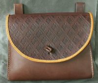 16th - 17th century belt wallet with a  tooled round front and side gussets
