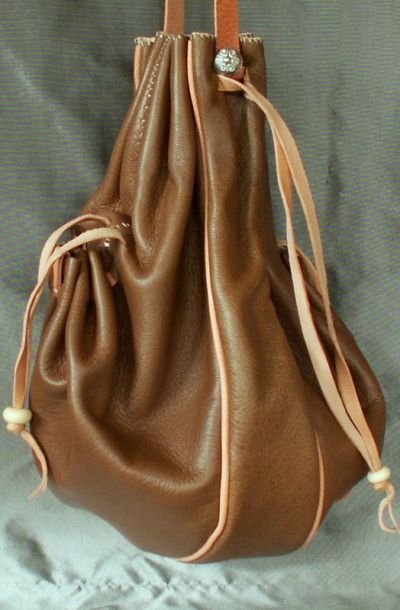 16th/17th century ladies draw string purse with a gusset, two side pockets and piped seams