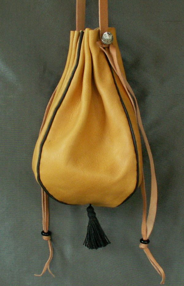 Ladies 14th/17th century round drawstring purse with piped seams and a tassel