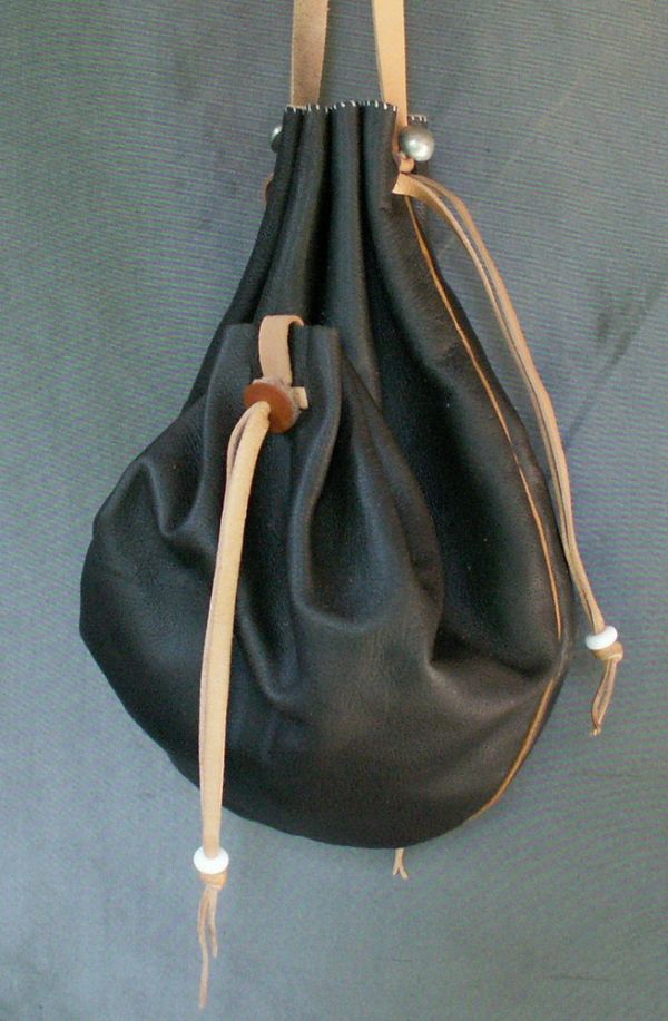 16th/17th century ladies draw string purse with two side pockets and piped seams
