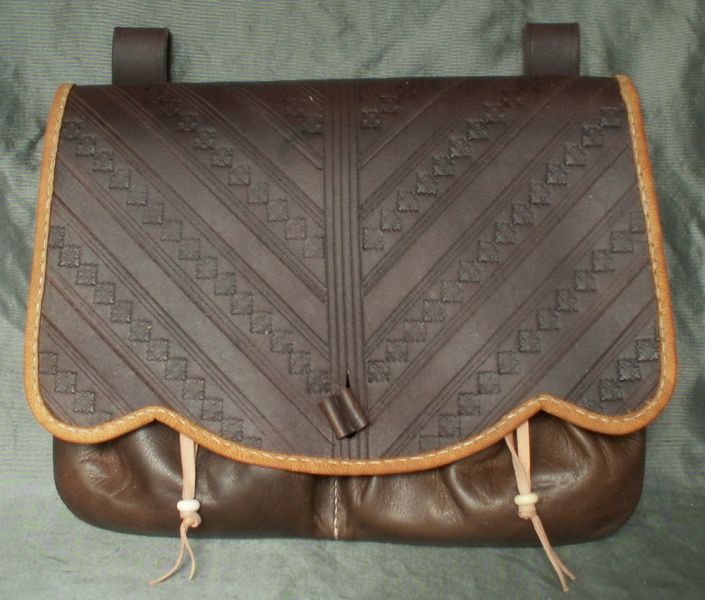 16th - 17th century large belt wallet with a tooled scalloped front and two pouchlets