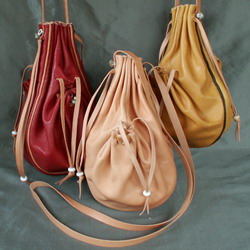 Draw string purse with two side pockets